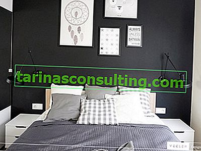 Una camera da letto in bianco e nero in stile scandinavo