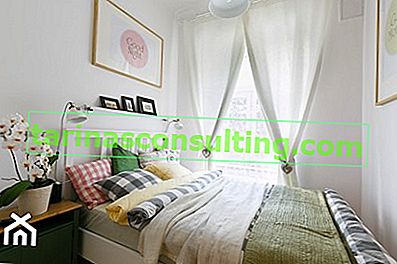ein subtiles Schlafzimmer mit einem Hauch von Grün, ein kleines Interieur